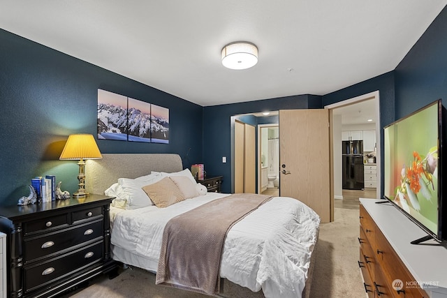 bedroom with carpet flooring and connected bathroom