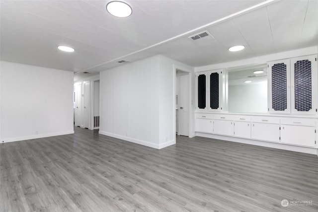 empty room with light hardwood / wood-style floors