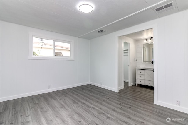 unfurnished bedroom featuring hardwood / wood-style floors