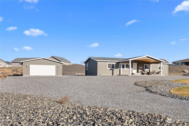 ranch-style house featuring a garage