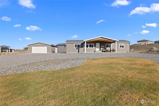 view of front facade featuring a front yard and a garage