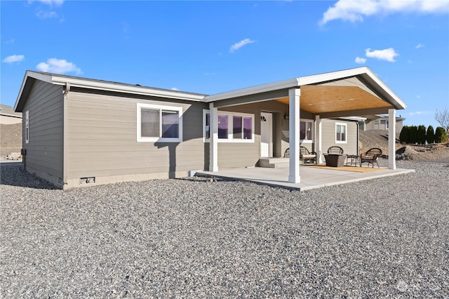 back of house with a patio area