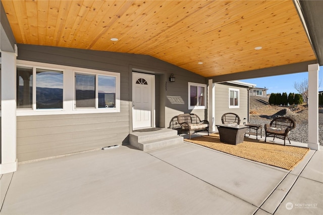 view of patio / terrace featuring an outdoor living space with a fire pit