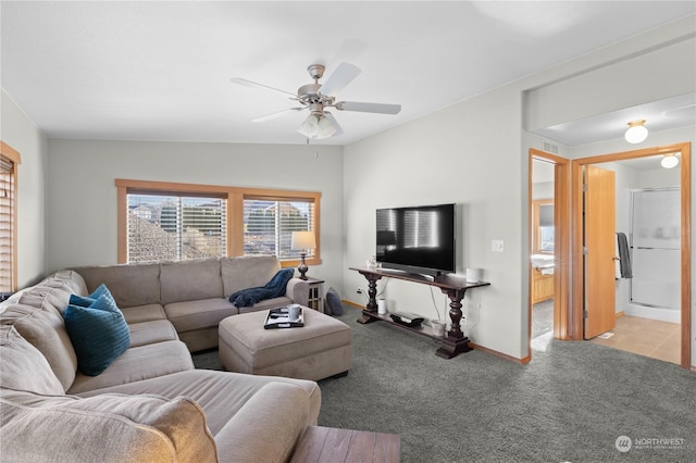 living room with ceiling fan and light colored carpet