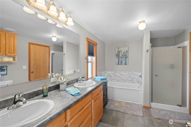 bathroom with vanity and separate shower and tub