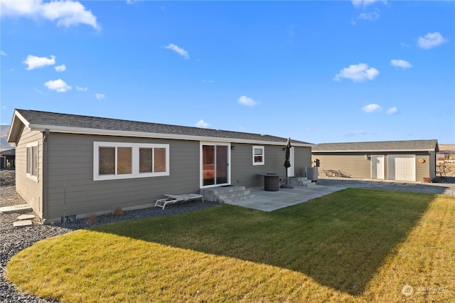 back of house featuring a patio area, central AC, a garage, and a yard