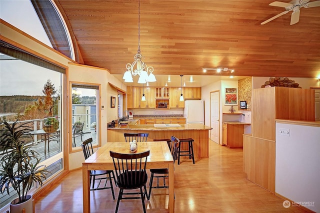 dining room featuring light wood-type flooring, ceiling fan with notable chandelier, vaulted ceiling, and wood ceiling