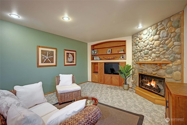 carpeted living room featuring a fireplace and built in features