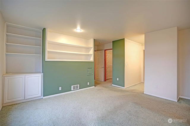 empty room with light colored carpet