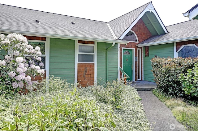 337 Moana Dr, Camano Island, WA 98282 - view of exterior entry featuring a shingled roof