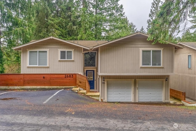 view of front of property with a garage