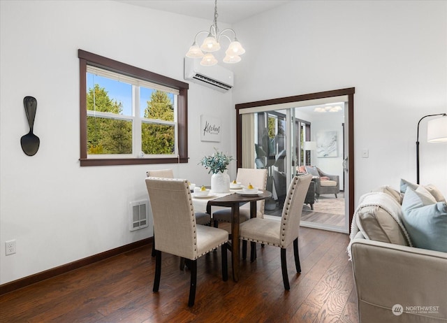 dining space with an inviting chandelier, a wall unit AC, plenty of natural light, and dark hardwood / wood-style floors