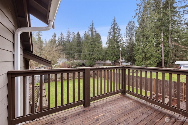 wooden terrace with a yard