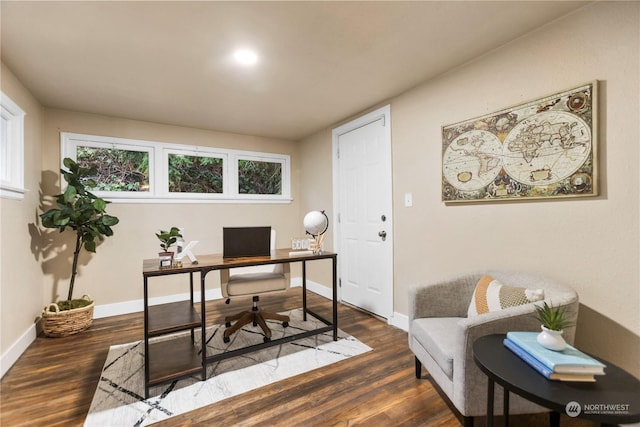 home office with dark hardwood / wood-style floors