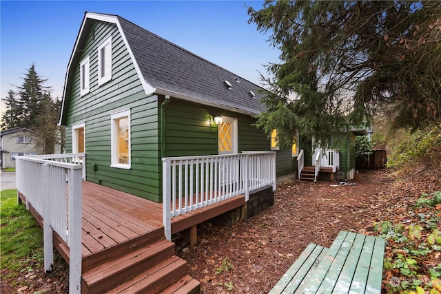 back of house featuring a wooden deck