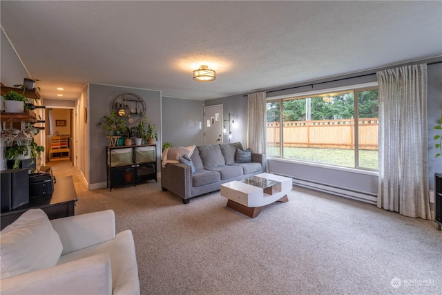 carpeted living room with a textured ceiling and baseboard heating