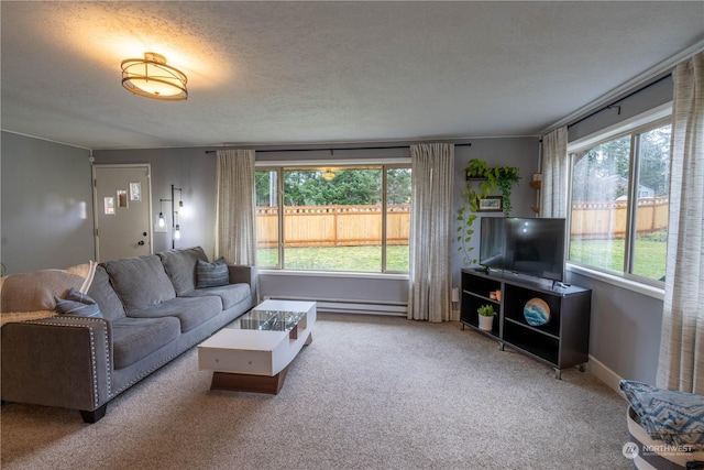 carpeted living room featuring a textured ceiling and baseboard heating