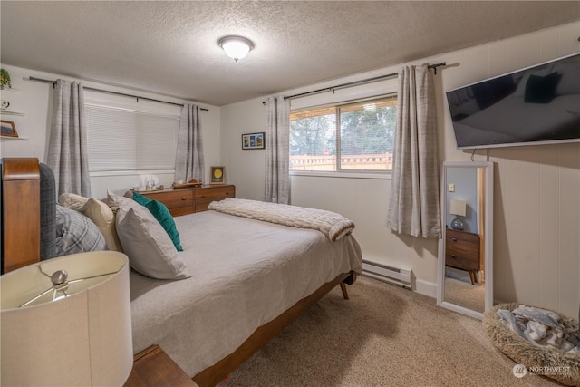 carpeted bedroom featuring a textured ceiling and a baseboard radiator