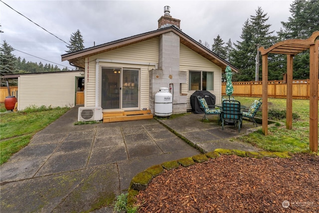 back of house featuring ac unit and a patio area