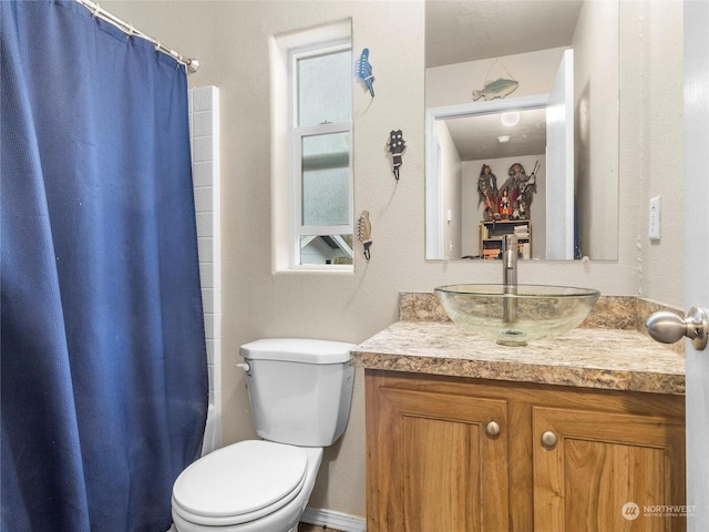 full bathroom featuring vanity, toilet, and shower / tub combo with curtain