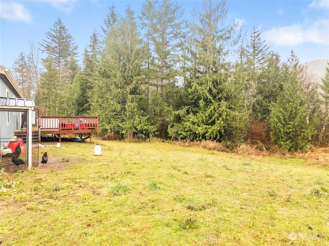 view of yard featuring a wooden deck