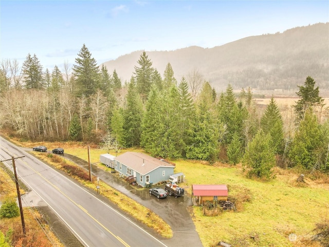 birds eye view of property with a mountain view