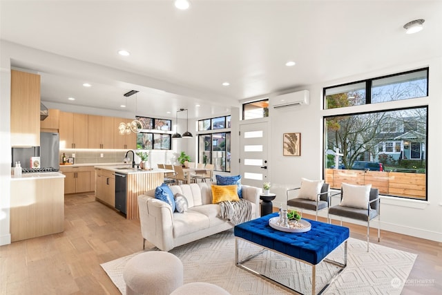 5537 34th Ave NE, Seattle, WA 98105 - living room with a wall mounted air conditioner, light hardwood / wood-style floors, a wealth of natural light, and sink
