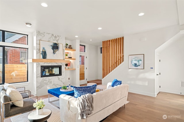 5537 34th Ave NE, Seattle, WA 98105 - living room with a high end fireplace and light hardwood / wood-style floors