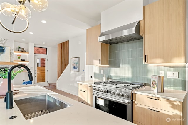 5537 34th Ave NE, Seattle, WA 98105 - kitchen with light brown cabinetry, high end stainless steel range, and sink