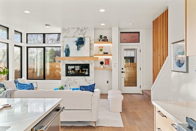 5537 34th Ave NE, Seattle, WA 98105 - living room with a high end fireplace and light wood-type flooring