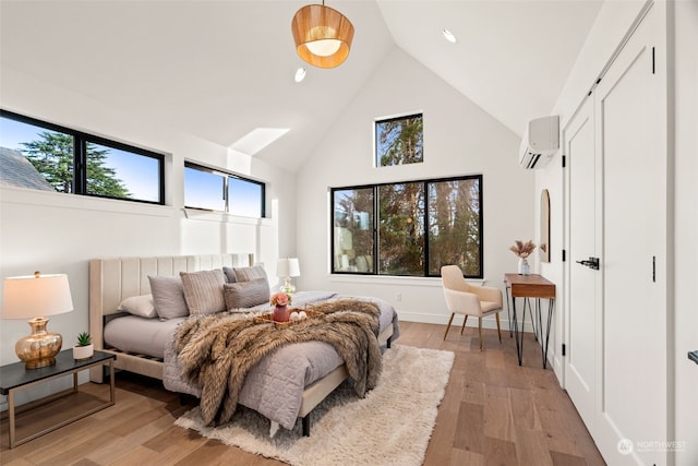 5537 34th Ave NE, Seattle, WA 98105 - bedroom with high vaulted ceiling, light hardwood / wood-style flooring, and a wall mounted AC