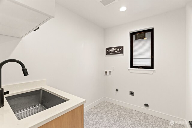 5537 34th Ave NE, Seattle, WA 98105 - washroom with sink, light tile patterned floors, washer hookup, and hookup for an electric dryer