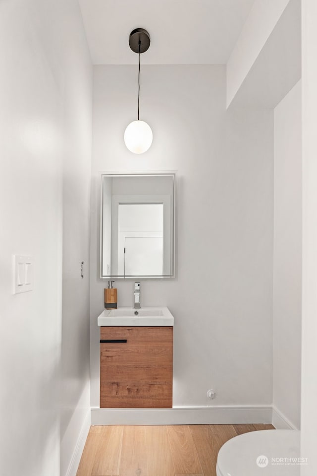 5537 34th Ave NE, Seattle, WA 98105 - bathroom with hardwood / wood-style floors, vanity, and toilet