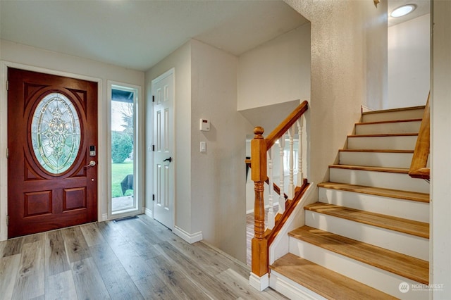 entrance foyer with light hardwood / wood-style floors