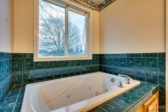 bathroom with tiled bath