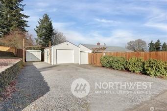 view of side of property with a garage