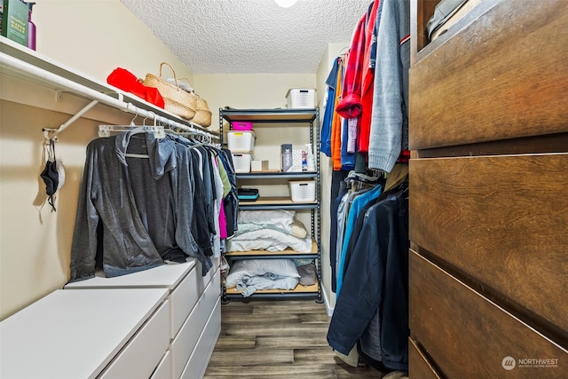 walk in closet featuring dark hardwood / wood-style flooring