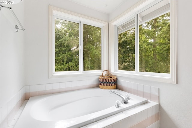 bathroom with tiled bath