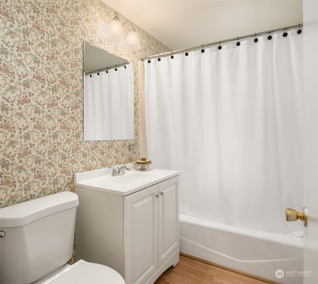 bathroom featuring hardwood / wood-style floors, vanity, and toilet