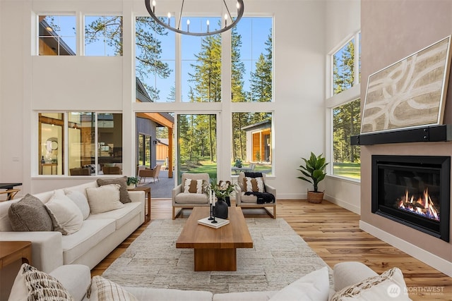 sunroom / solarium with plenty of natural light and a chandelier