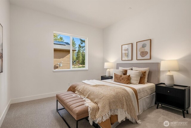 bedroom featuring carpet floors and baseboards