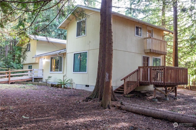 rear view of property with a deck