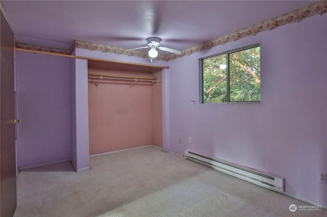 unfurnished bedroom with a closet, ceiling fan, light colored carpet, and a baseboard radiator