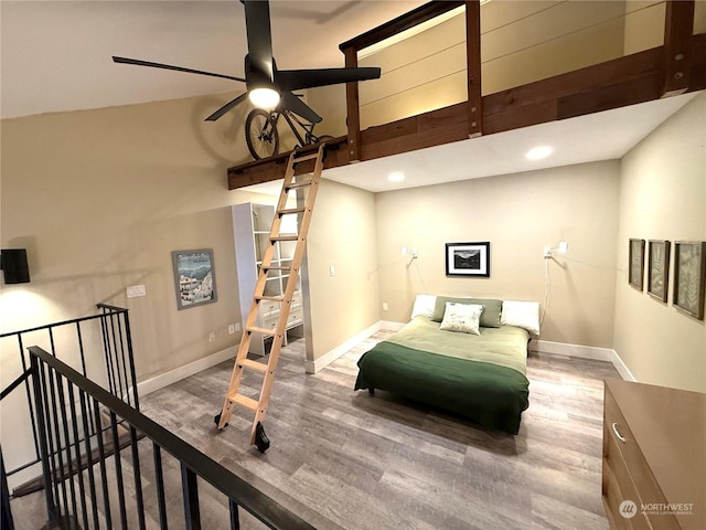 bedroom featuring wood-type flooring and ceiling fan