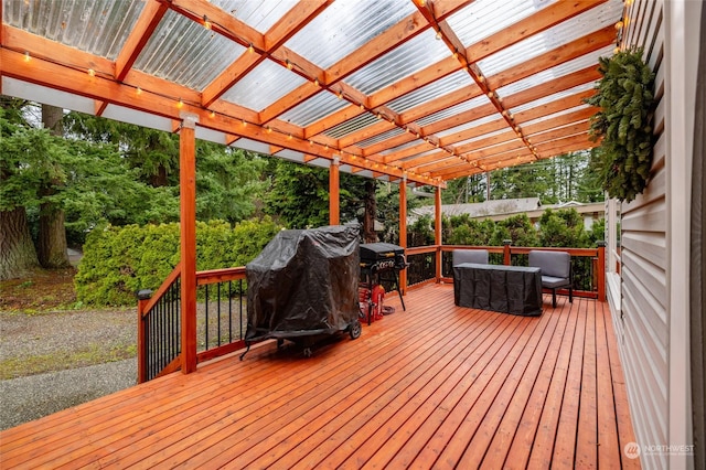 wooden deck featuring grilling area