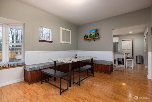 dining space featuring breakfast area and light wood-type flooring