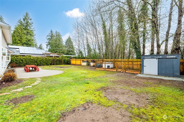 view of yard featuring a shed and a patio