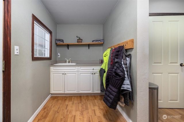 interior space with light wood-type flooring and sink