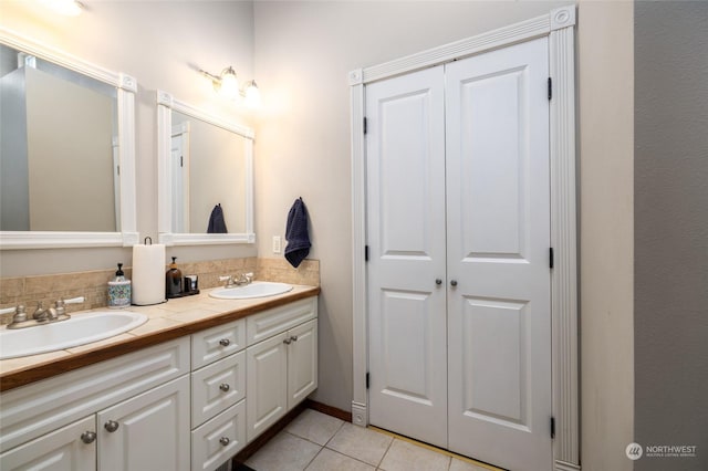 bathroom with tile patterned floors and vanity