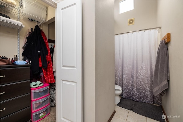 bathroom with tile patterned flooring